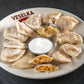 Bacon Egg and Cheese pierogi, boiled on a plate 